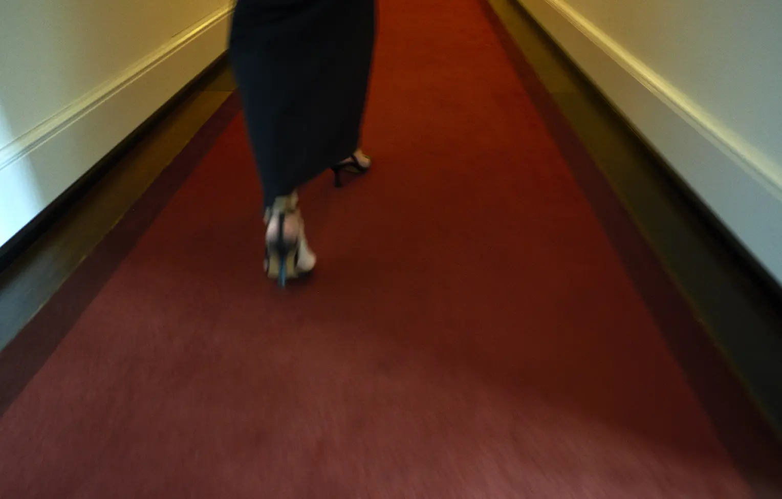 Yvonne reichmuth walks through the dolder grand corridor
